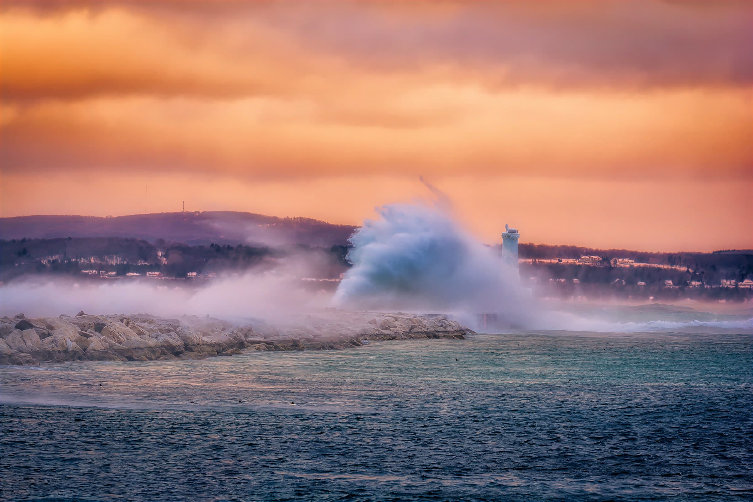 Powerful winter storm crashing over a Great Lakes breakwall