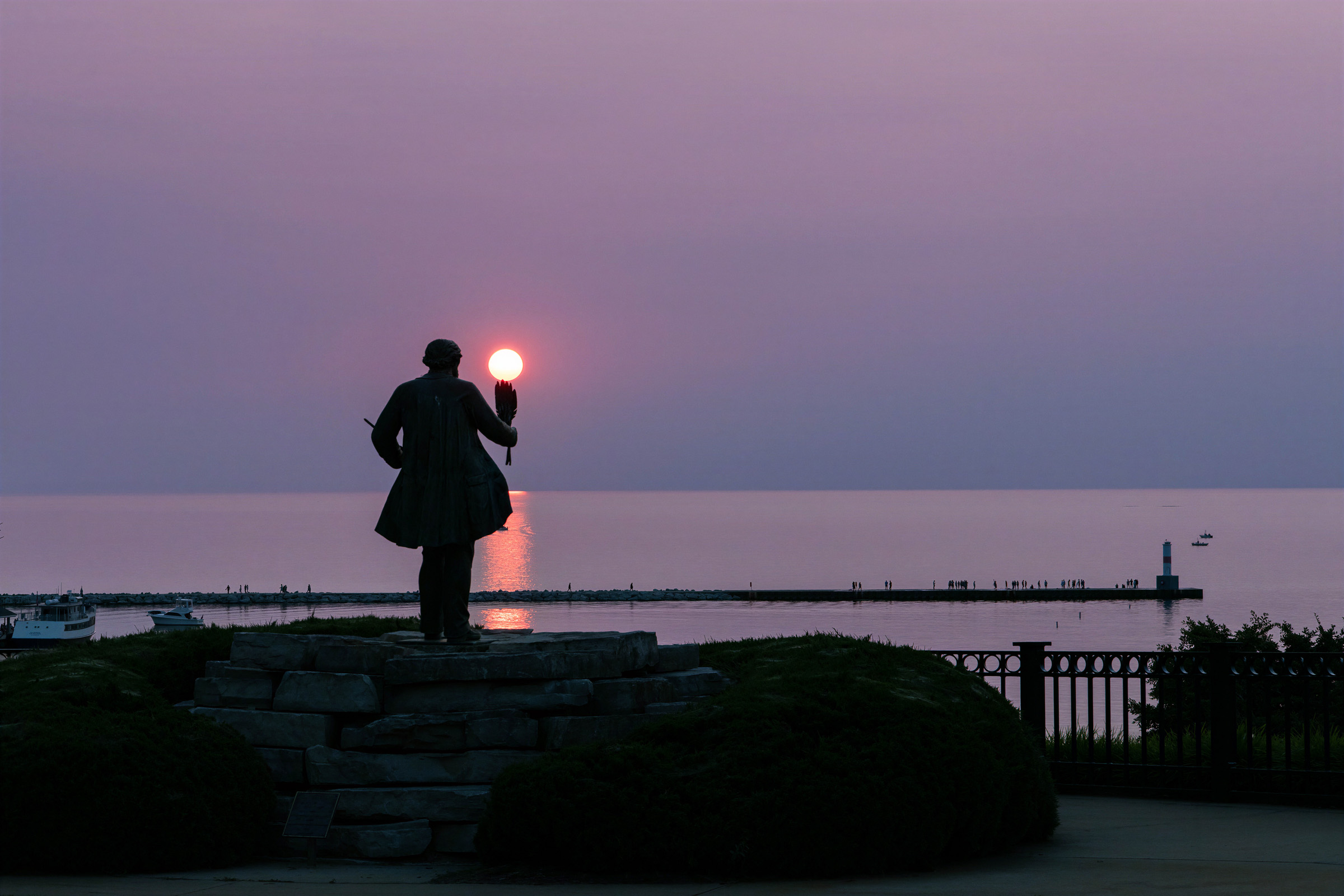 Chief Petoskey statue overlooking a Northern Michigan sunset